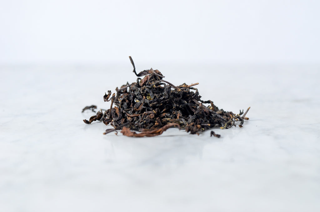 pile of loose leaf tea on a marble background