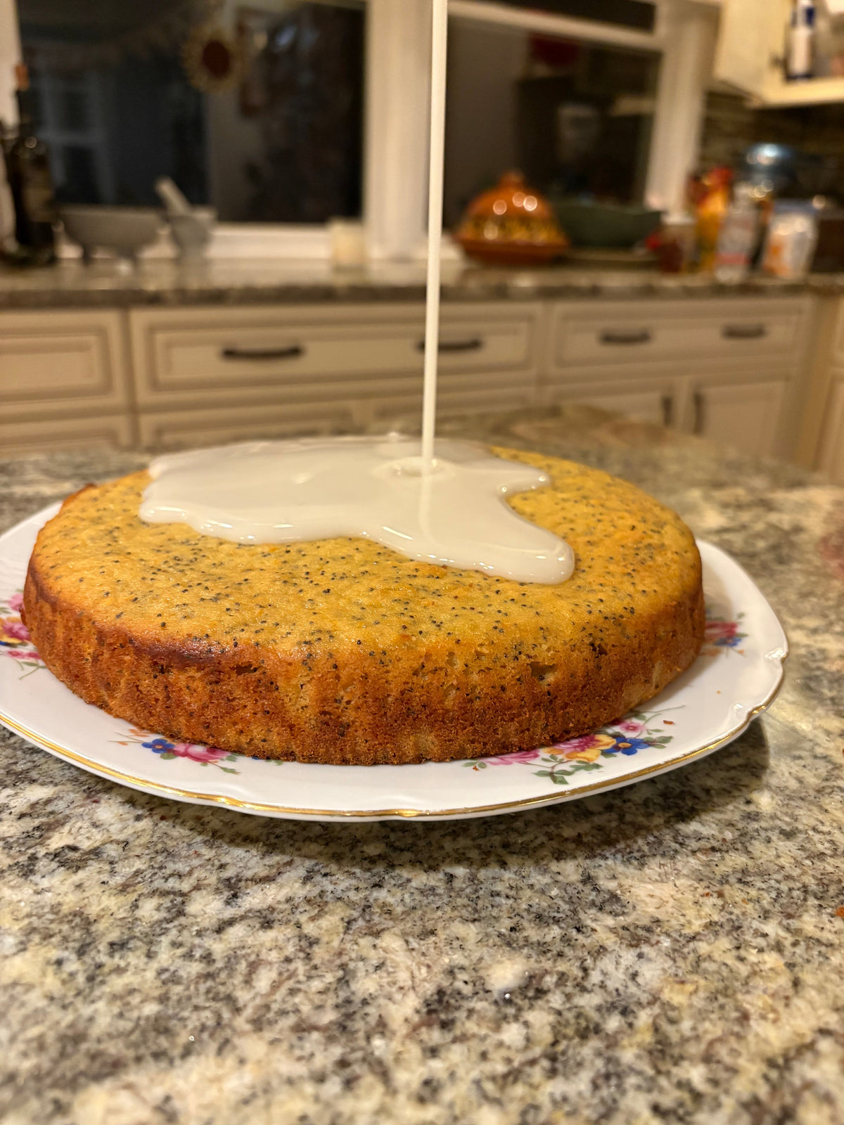 Orange poppyseed cake with glue drizzled on top.