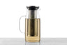 A 1 quart glass iced tea pitcher with a detachable infuser filled with pale yellow tea.