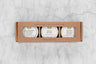 Fruity Honey Gift Set featuring three mini jars of honey: Elderberry Infused Honey, Peach Honey, and Mango Infused Honey.