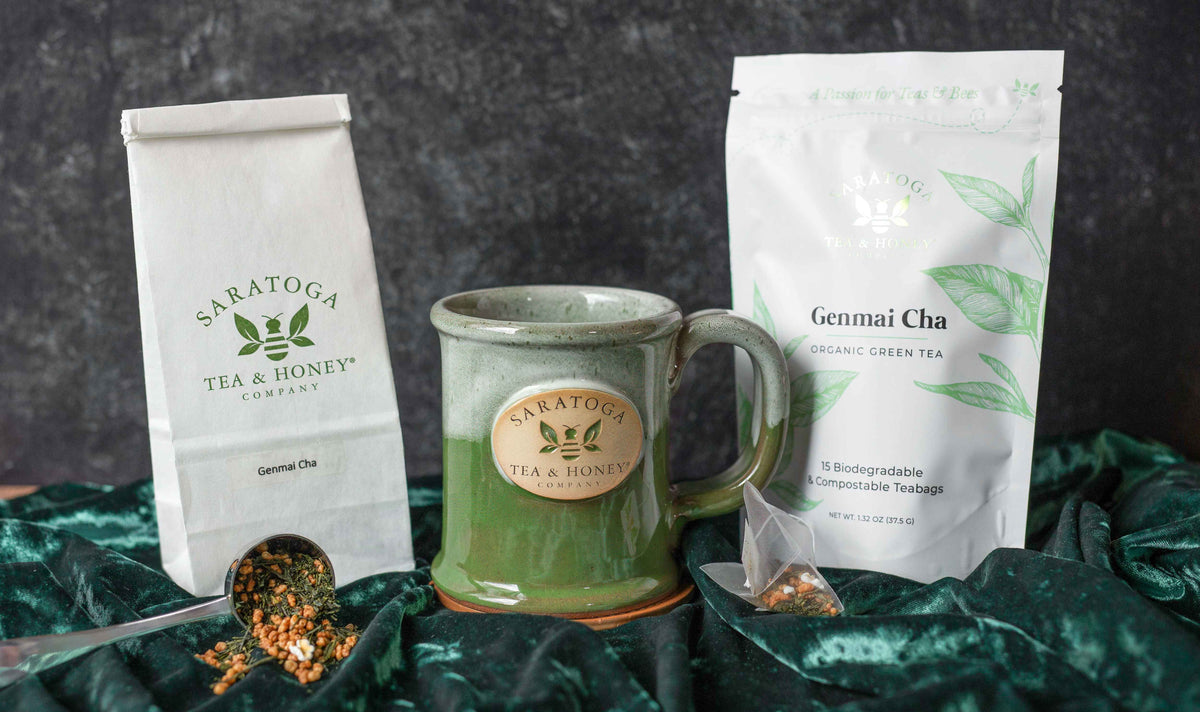 Genmai Cha tea sachets and looseleaf Genmai Cha tea with a mug.