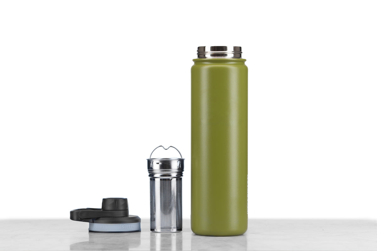 A green tea tumbler with a stainless steel infuser basket.