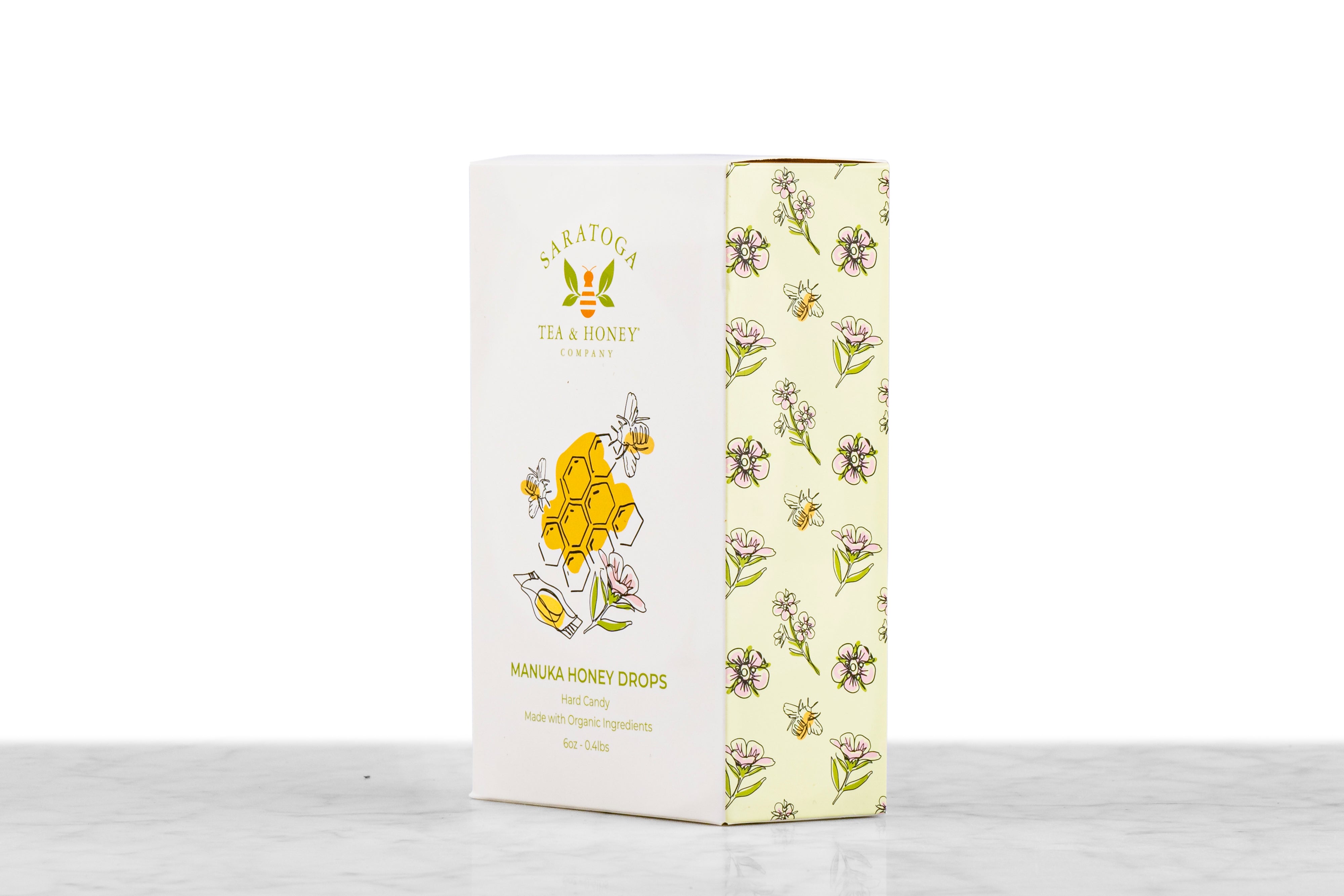 Angled view of Manuka Honey Drops honey candy box from Saratoga Tea & Honey Co. showing front and side design
