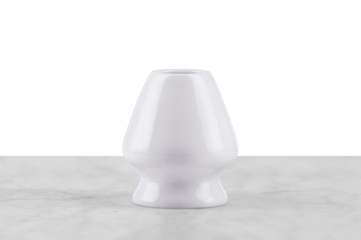 A white ceramic matcha whisk stand.