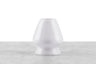 A white ceramic matcha whisk stand.