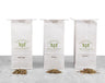 The three Motherhood & Fertility Bundle Teas lined up next to each other in white Saratoga Tea & Honey Co. tea bags with piles of corresponding teas in front: Bonjour Bebe, Baby Bump & Mother Earth