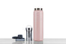 A pink tea tumbler with a stainless steel infuser basket.
