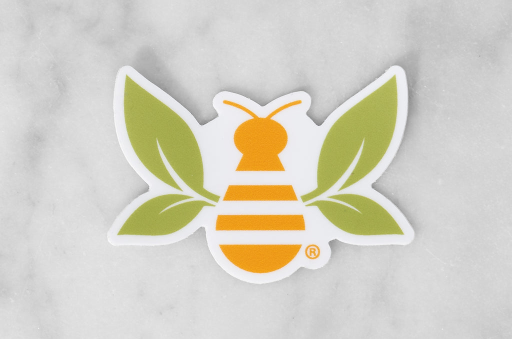 Saratoga Tea & Honey Co registered trademark tea bee sticker on marble background