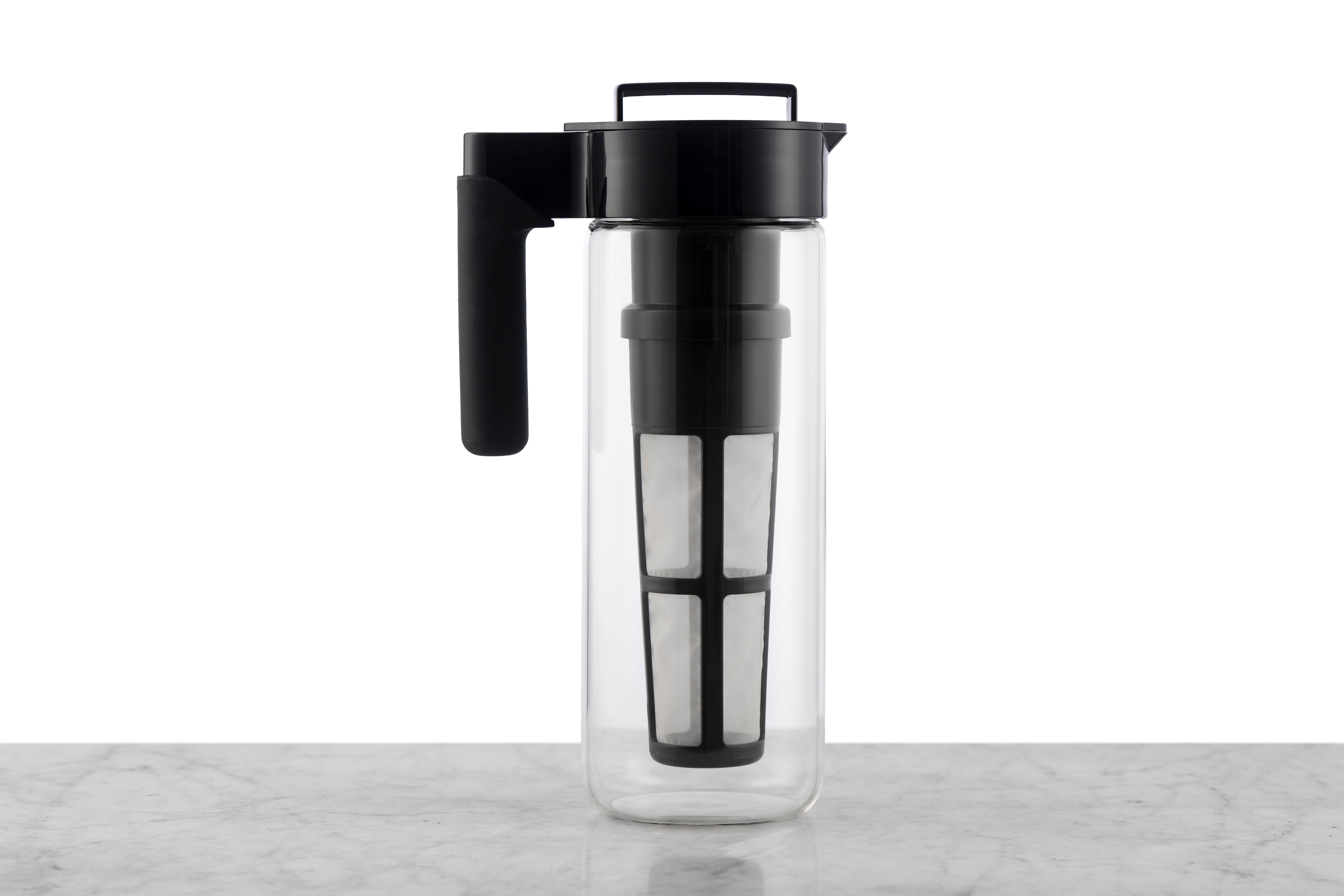 A 2 quart glass iced tea pitcher with a detachable infuser for loose tea.