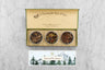 winter tea gift set in green box with yellow inside reading a passion for teas and bees with three mini tins of tea and an insert card with design and tea descriptions