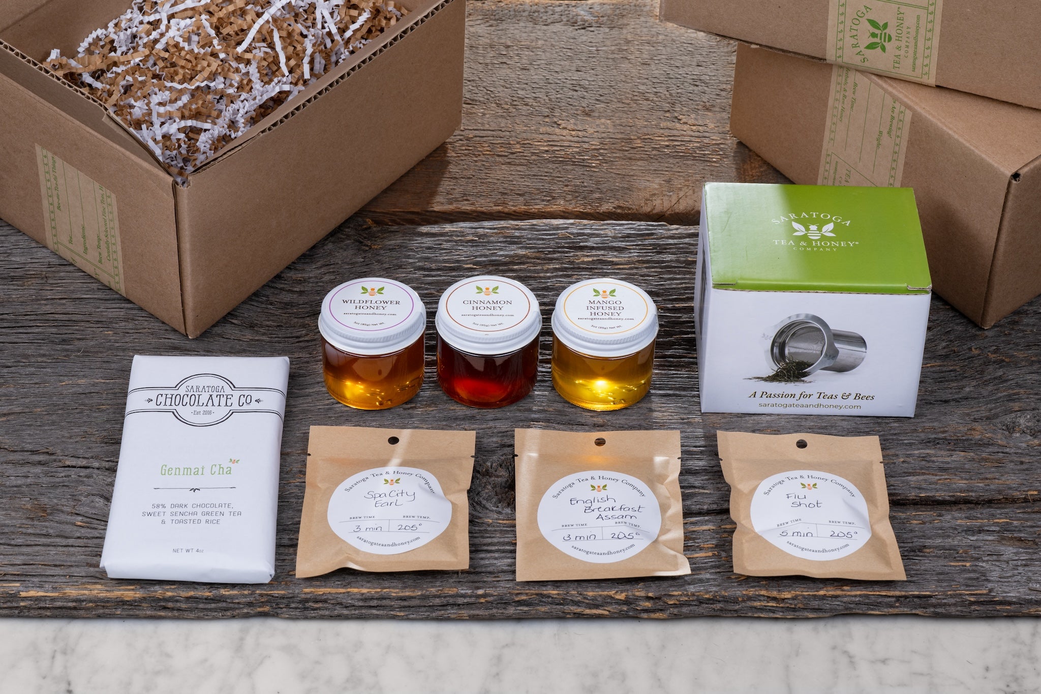 honey bee gift set on wood background with sample shipping boxes