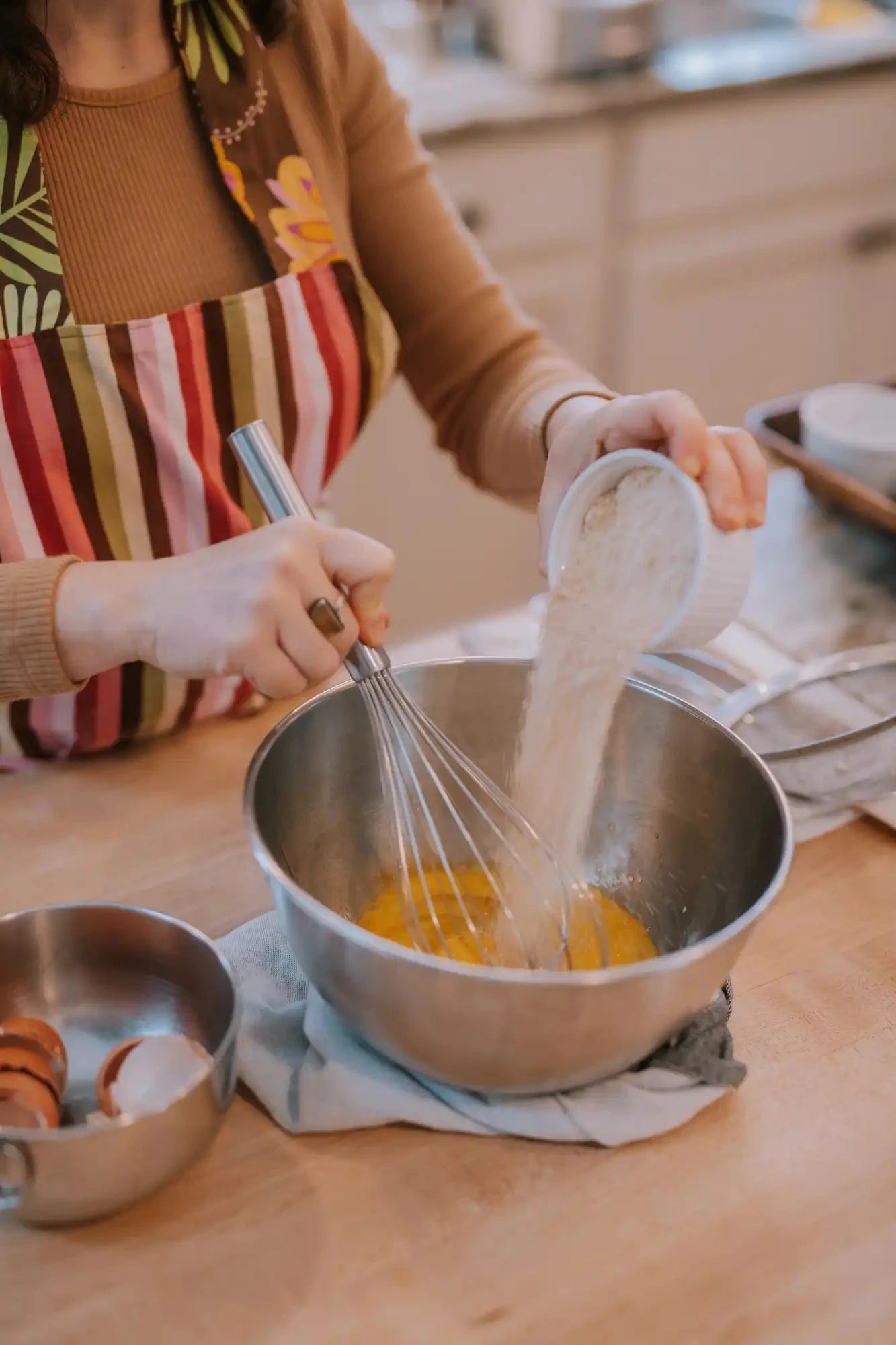 whisking dry ingredients slowly into wet ingredients