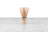 bamboo matcha whisk on a marble and white background