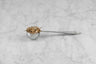 tea scoop full of loose leaf tea
